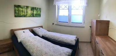 Ein Bett oder Betten in einem Zimmer der Unterkunft Kompassrose