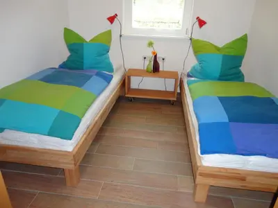 Ein Bett oder Betten in einem Zimmer der Unterkunft Boddenfrosch