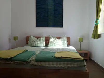 Ein Bett oder Betten in einem Zimmer der Unterkunft Boddenfrosch