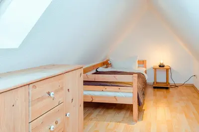 Ein Bett oder Betten in einem Zimmer der Unterkunft Ferienhaus Sanddorn, Fewo Strandaster