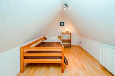 Ein Bett oder Betten in einem Zimmer der Unterkunft Ferienhaus Sanddorn, Fewo Strandaster