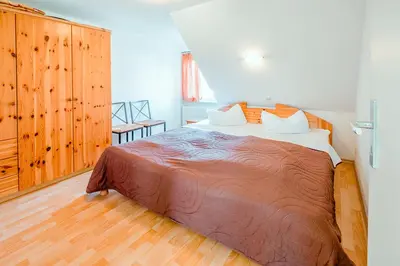 Ein Bett oder Betten in einem Zimmer der Unterkunft Ferienhaus Sanddorn, Fewo Strandaster
