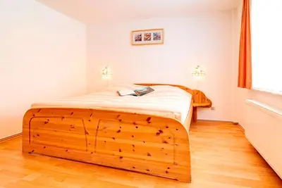 Ein Bett oder Betten in einem Zimmer der Unterkunft Ferienhaus Sanddorn, Fewo Seetang