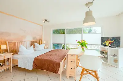 Ein Bett oder Betten in einem Zimmer der Unterkunft Ferienhaus Sanddorn, Studio