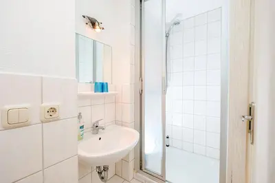 Ein Badezimmer in der Unterkunft Ferienhaus Sanddorn, Studio