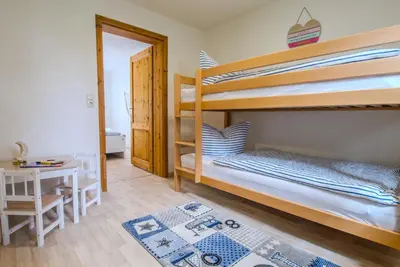 Ein Bett oder Betten in einem Zimmer der Unterkunft Ferienwohnung im Landmannsheim