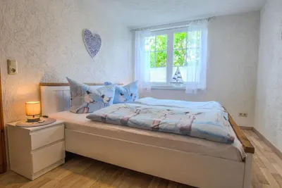 Ein Bett oder Betten in einem Zimmer der Unterkunft Ferienwohnung im Landmannsheim
