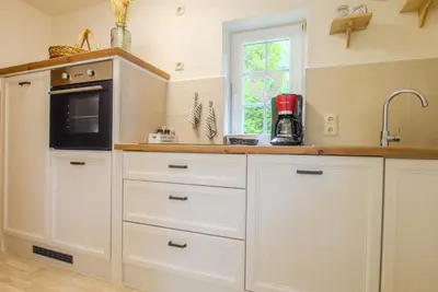 Küche/Küchenzeile in der Unterkunft Ferienwohnung im Landmannsheim