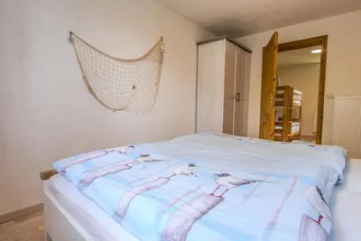 Ein Bett oder Betten in einem Zimmer der Unterkunft Ferienwohnung im Landmannsheim