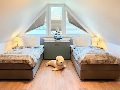 Ein Bett oder Betten in einem Zimmer der Unterkunft Störtebekerkoje 12 4