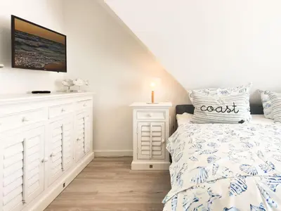 Ein Bett oder Betten in einem Zimmer der Unterkunft Störtebekerkoje 12 5