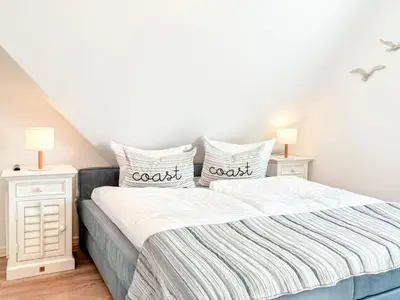 Ein Bett oder Betten in einem Zimmer der Unterkunft Störtebekerkoje 12 5