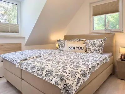 Ein Bett oder Betten in einem Zimmer der Unterkunft Störtebekerkoje 12a 4
