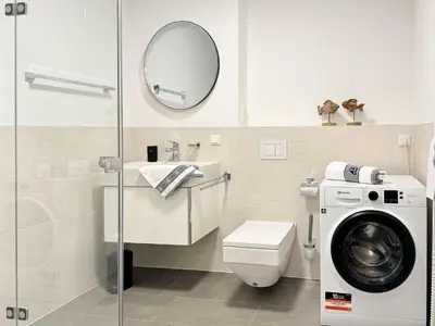 Ein Badezimmer in der Unterkunft Küstenkajüte Whg 2
