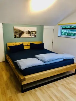 Ein Bett oder Betten in einem Zimmer der Unterkunft OstseeFreiheit