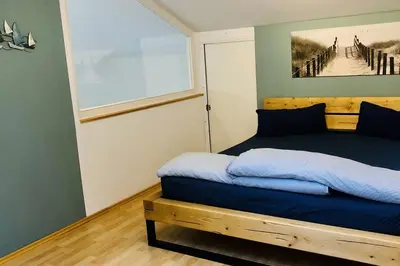 Ein Bett oder Betten in einem Zimmer der Unterkunft OstseeFreiheit