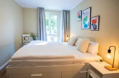 Ein Bett oder Betten in einem Zimmer der Unterkunft Meereswoge Zingst - 5-Sterne Erholung an der Ostseeküste
