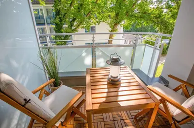 Ein Balkon oder eine Terrasse in der Unterkunft Meereswoge Zingst - 5-Sterne Erholung an der Ostseeküste
