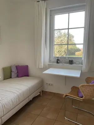 Ein Bett oder Betten in einem Zimmer der Unterkunft Ferienwohnung Störtebeker