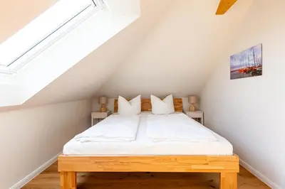 Ein Bett oder Betten in einem Zimmer der Unterkunft Eenhoorn