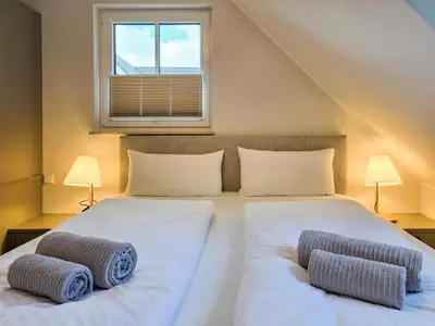 Ein Bett oder Betten in einem Zimmer der Unterkunft Störtebekerkoje 12a 6