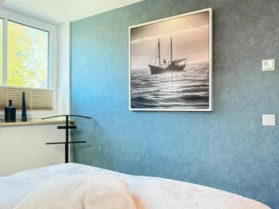 Ein Bett oder Betten in einem Zimmer der Unterkunft Störtebekerkoje 12a 6
