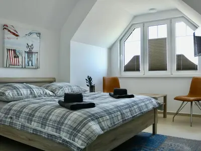 Ein Bett oder Betten in einem Zimmer der Unterkunft Yvette 2 - Meer, Sand, Zingst - Ihr Urlaubsparadies