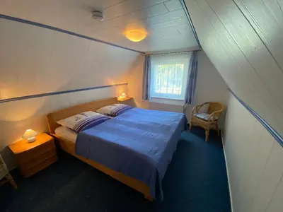 Ein Bett oder Betten in einem Zimmer der Unterkunft Buhne 5