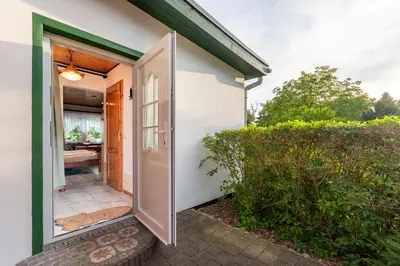 Ein Bett oder Betten in einem Zimmer der Unterkunft Am Bodden Krapp´s - Apartment