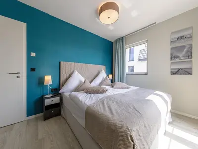 Ein Bett oder Betten in einem Zimmer der Unterkunft Alte Seefahrtschule App A120 