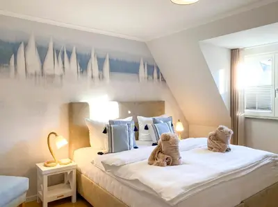 Ein Bett oder Betten in einem Zimmer der Unterkunft Sonnenseite Parkliebe, App 05