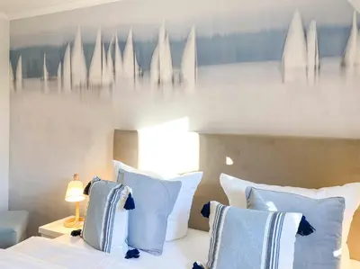 Ein Bett oder Betten in einem Zimmer der Unterkunft Sonnenseite Parkliebe, App 05