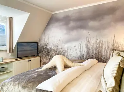 Ein Bett oder Betten in einem Zimmer der Unterkunft Sonnenseite Parkliebe, App 05
