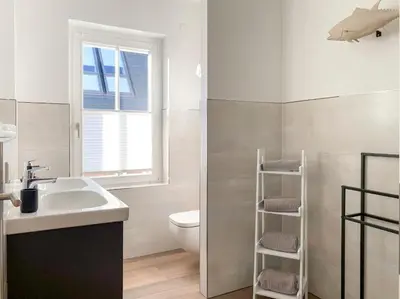 Ein Badezimmer in der Unterkunft Sonnenseite Dünenliebe, App 16