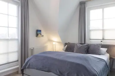 Ein Bett oder Betten in einem Zimmer der Unterkunft Ferienhäuser Doppelhaushälfte Hahn
