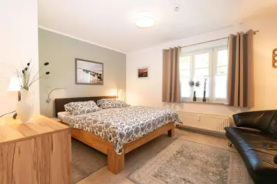 Ein Bett oder Betten in einem Zimmer der Unterkunft Boddenquartett App 05 