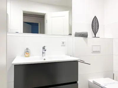 Ein Badezimmer in der Unterkunft Sonnenseite Parkliebe, App 04