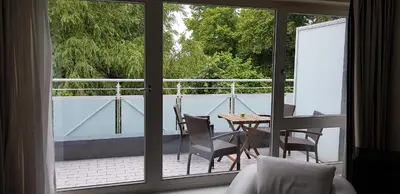 Ein Balkon oder eine Terrasse in der Unterkunft Am Kurhaus 614-Strandidyll Villa Kurpark