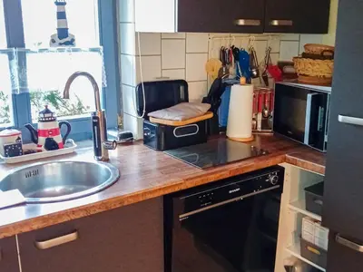 Küche/Küchenzeile in der Unterkunft Lütt Stuuv am Dorfanger