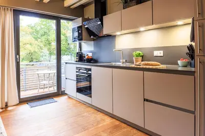 Küche/Küchenzeile in der Unterkunft Goldregen - waldnah mit Kamin und Balkon