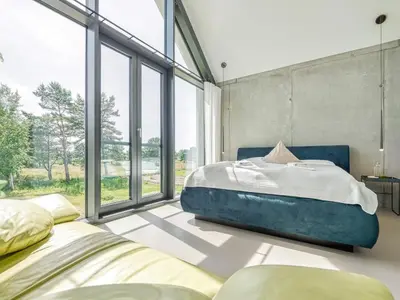 Ein Bett oder Betten in einem Zimmer der Unterkunft Ferienhaus in Fuhlendorf am Boddenhafen