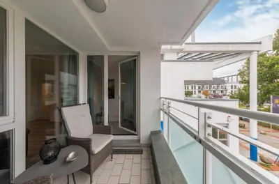 Ein Balkon oder eine Terrasse in der Unterkunft 5-Sterne-Ferienwohnung Ostseeglück Zingst inklusive Strandkorb von April-Oktober