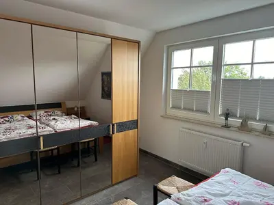 Ein Bett oder Betten in einem Zimmer der Unterkunft Sünnenkringel 68 Whg 5