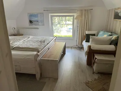 Ein Bett oder Betten in einem Zimmer der Unterkunft Boddenkate Fuhlendorf