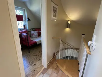 Ein Bett oder Betten in einem Zimmer der Unterkunft Boddenhus Fuhlendorf
