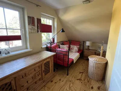 Ein Bett oder Betten in einem Zimmer der Unterkunft Boddenhus Fuhlendorf