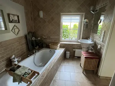 Ein Badezimmer in der Unterkunft Boddenhus Fuhlendorf