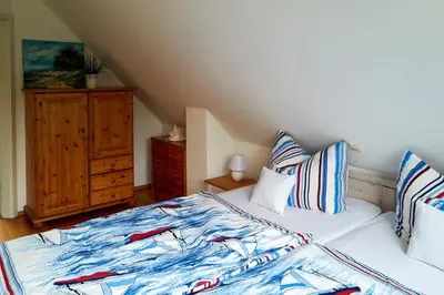 Ein Bett oder Betten in einem Zimmer der Unterkunft Ferienhaus Waldblick
