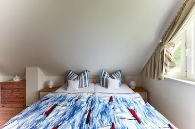 Ein Bett oder Betten in einem Zimmer der Unterkunft Ferienhaus Waldblick
