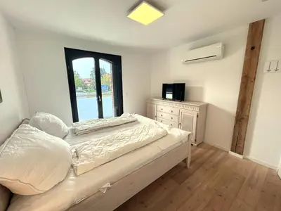 Ein Bett oder Betten in einem Zimmer der Unterkunft FEWO Sonnenschein 1,7